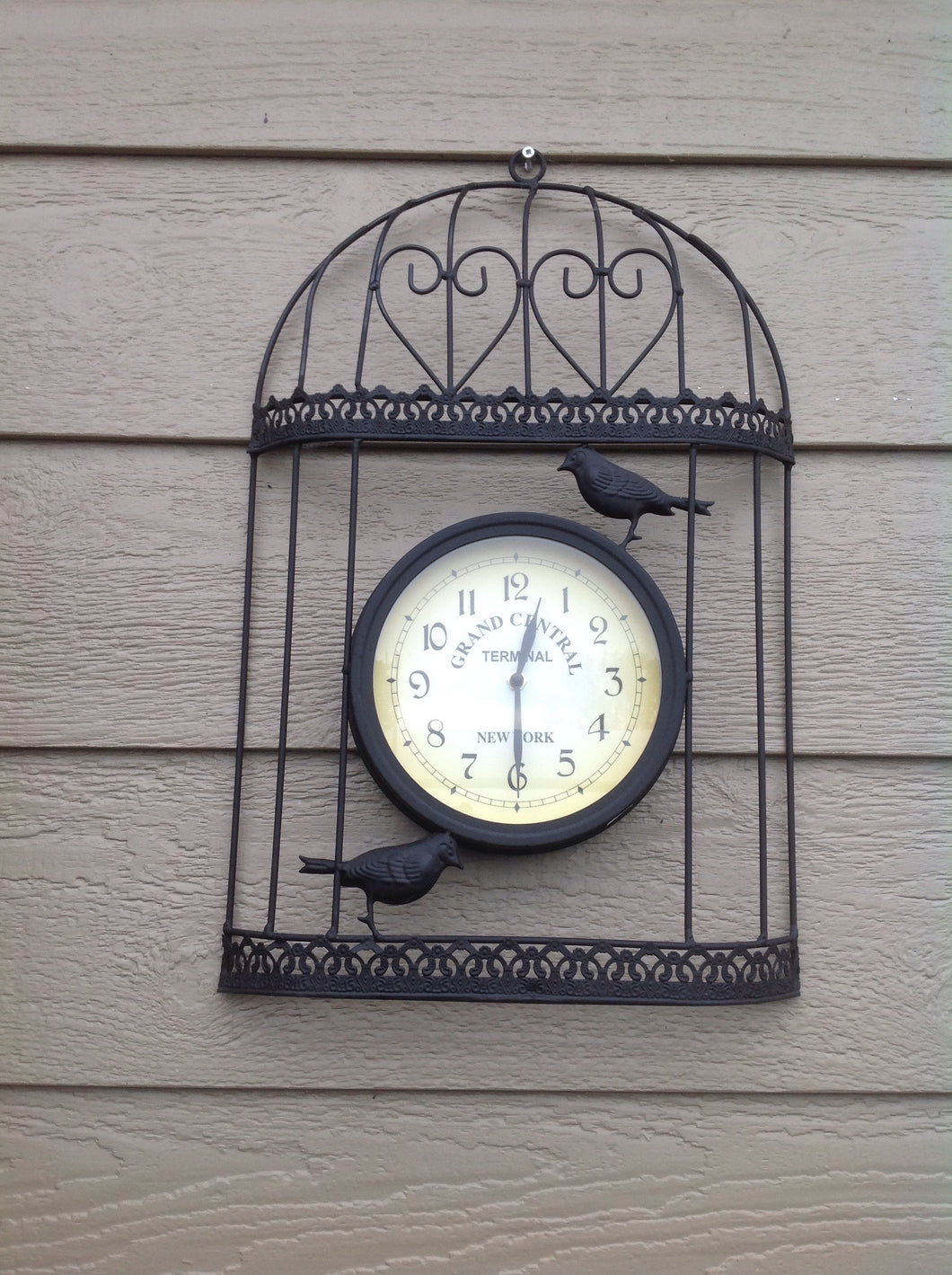horloge murale avec oiseaux